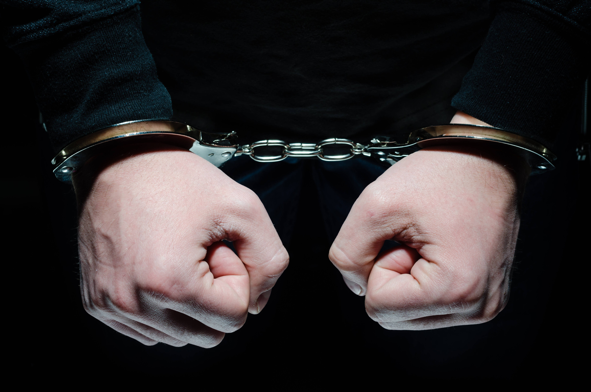 male hands in handcuffs